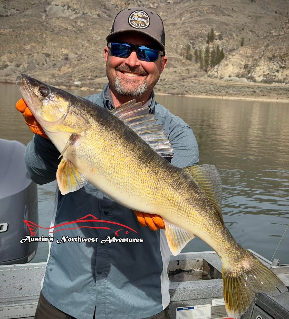 Austin Moser holding a large walleye