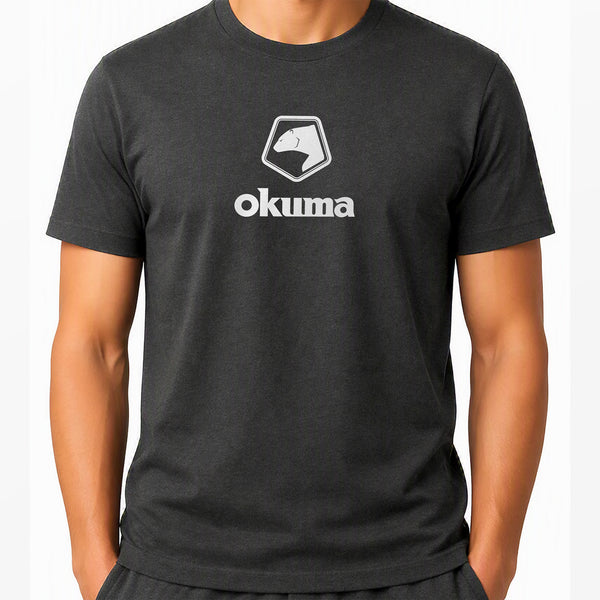 A man wearing a dark charcoal gray short-sleeve t-shirt with a white printed Okuma logo on the chest, shown against a plain white background.