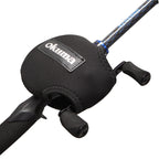 Close-up of a black Okuma fishing rod handle cover with a stitched neoprene sleeve and a visible Okuma logo patch, mounted on a fishing rod against a white background.