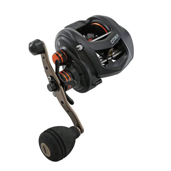 A black baitcasting fishing reel with a brown handle and orange accents, shown on a solid white background. The brand name CITRIX is visible on the side of the reel housing.
